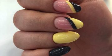 Fashionable yellow and black manicure